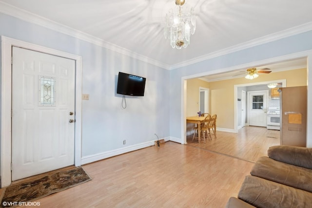 living room featuring wood-type flooring, ceiling fan, and crown molding