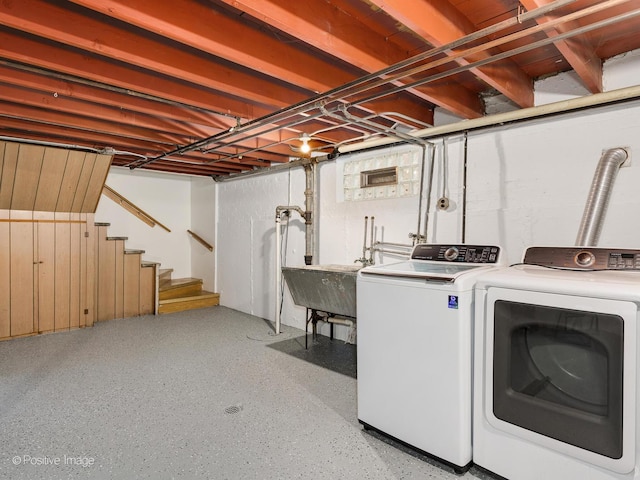 laundry area with washer and dryer and sink