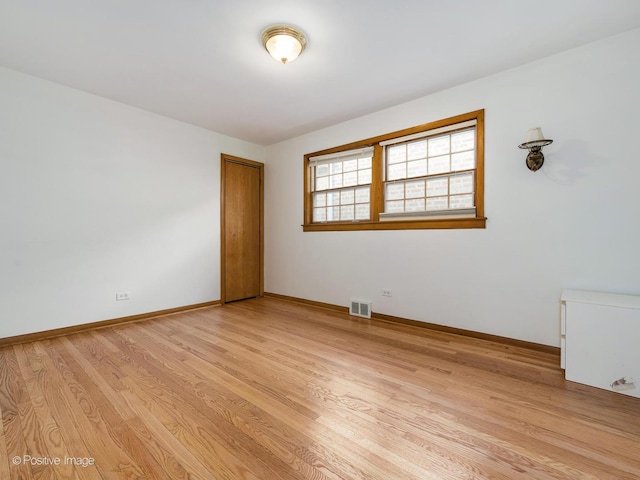 unfurnished room featuring light hardwood / wood-style floors