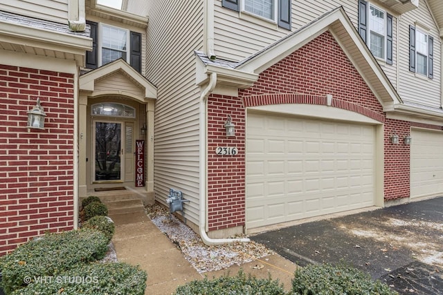 property entrance with a garage