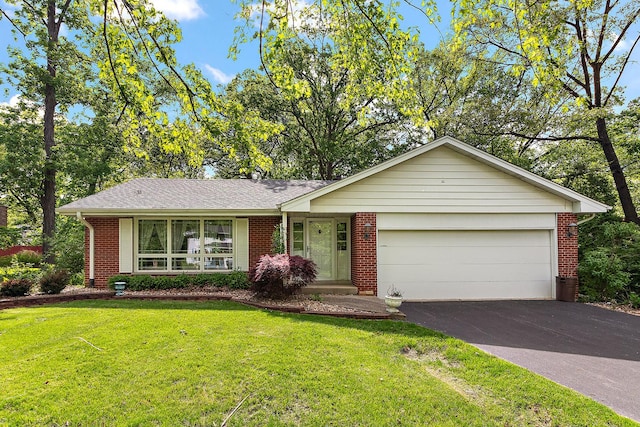 3530 Chalet Ln, Crete, IL 60417 - ranch-style house featuring brick siding, driveway, a garage, a front lawn, and roof with shingles