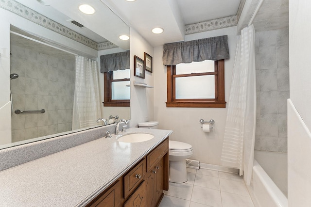 full bathroom featuring shower / bath combo with shower curtain, tile patterned flooring, vanity, and toilet