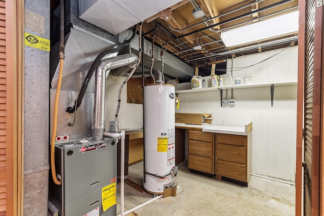 utility room featuring water heater