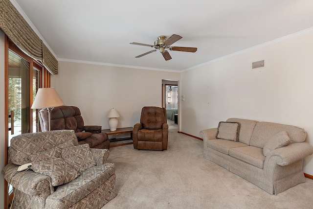 carpeted living room featuring ceiling fan and crown molding