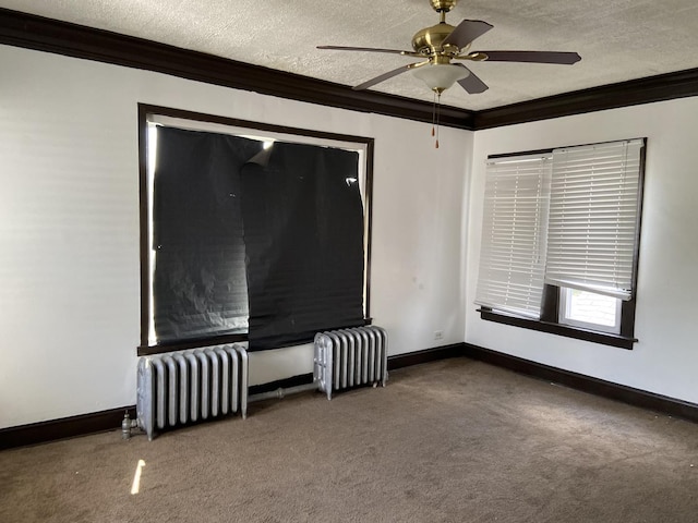 unfurnished living room with carpet flooring, a textured ceiling, radiator, and crown molding