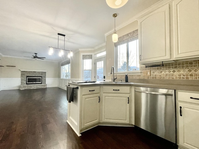 kitchen with ceiling fan, dishwasher, hanging light fixtures, dark hardwood / wood-style floors, and crown molding