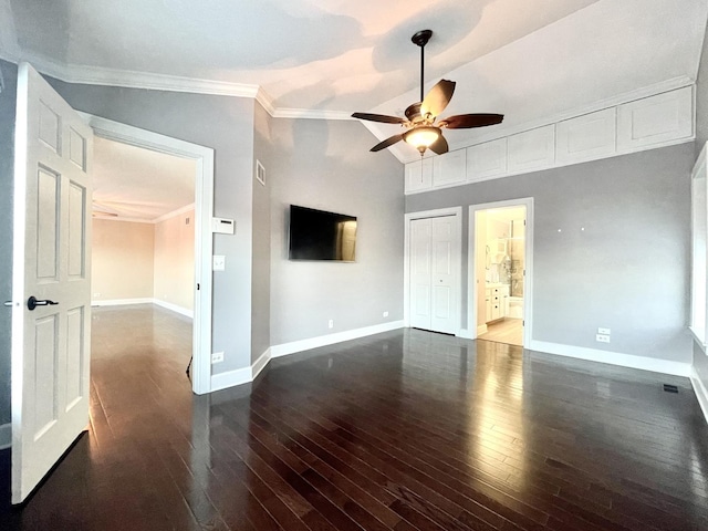 unfurnished living room with ceiling fan, crown molding, lofted ceiling, and dark wood-type flooring