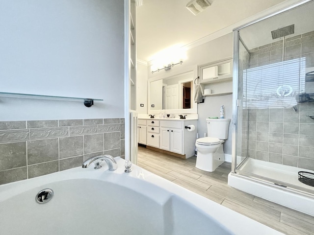 full bathroom with crown molding, vanity, independent shower and bath, and toilet