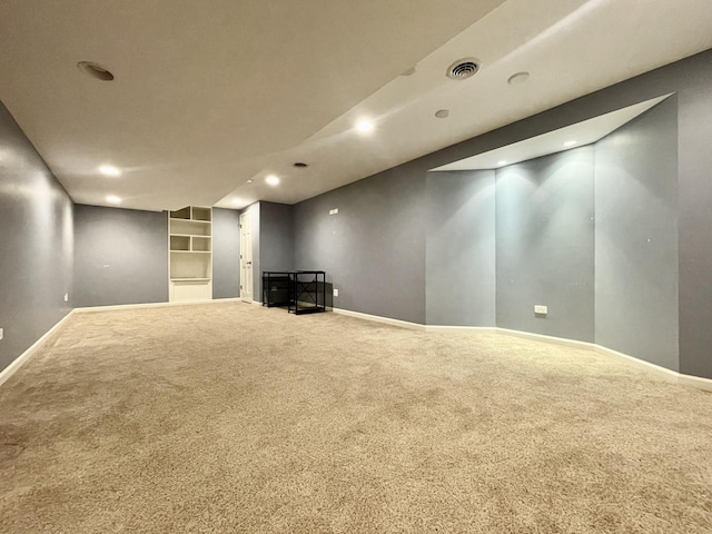 basement with carpet flooring and built in features