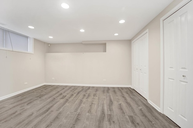 basement featuring light hardwood / wood-style flooring