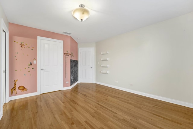 unfurnished room with light hardwood / wood-style flooring