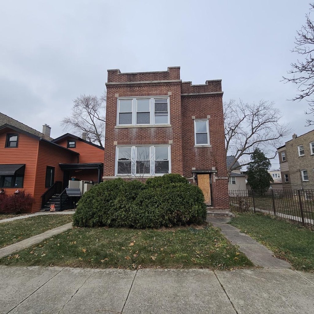 view of property with a front lawn