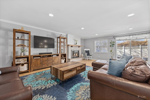 living room featuring a fireplace, hardwood / wood-style floors, and ornamental molding