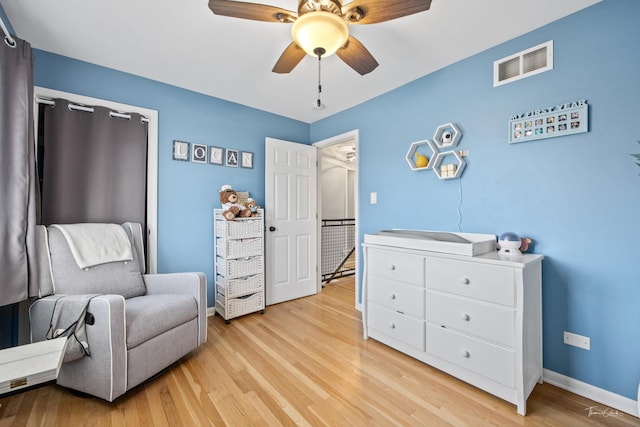 sitting room featuring ceiling fan and light hardwood / wood-style flooring