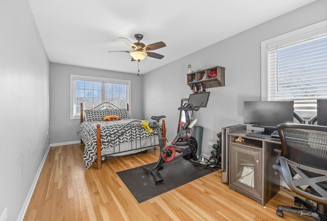 bedroom featuring hardwood / wood-style flooring and ceiling fan