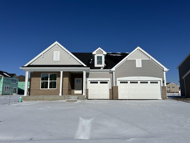 view of front of home featuring a front yard and a garage