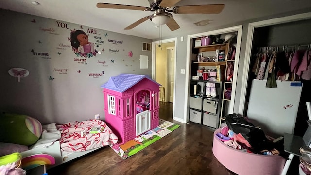 bedroom featuring dark hardwood / wood-style flooring, a closet, and ceiling fan