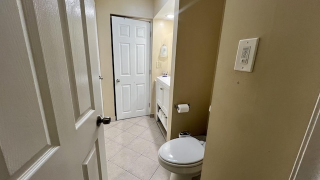 bathroom with vanity, tile patterned floors, and toilet