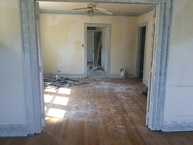 misc room featuring ceiling fan and dark hardwood / wood-style floors