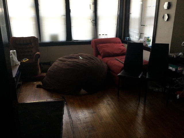 sitting room with wood-type flooring