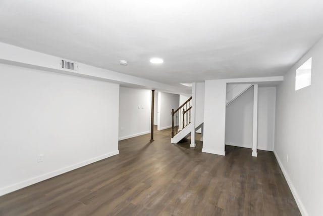 basement with dark wood-type flooring