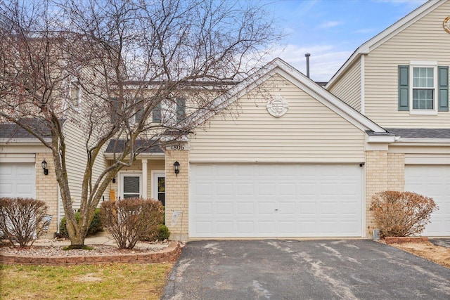 front of property with a garage