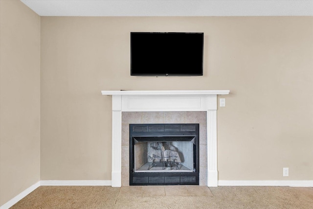 details with carpet and a tiled fireplace