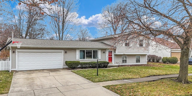 tri-level home with a front yard and a garage