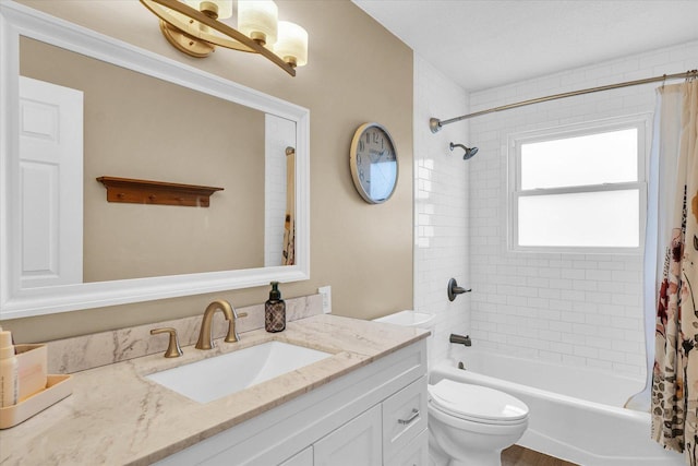 full bathroom featuring shower / bathtub combination with curtain, hardwood / wood-style floors, vanity, and toilet