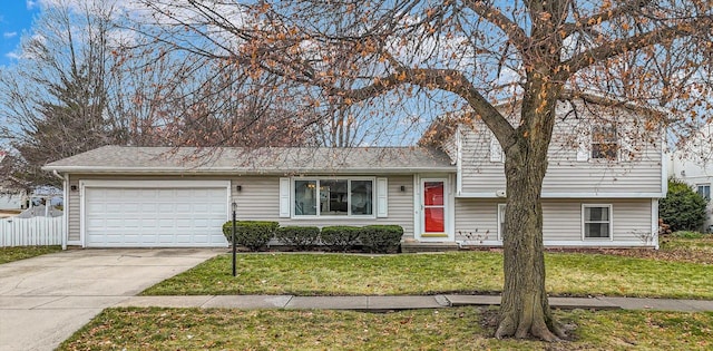 view of front facade with a garage and a front yard