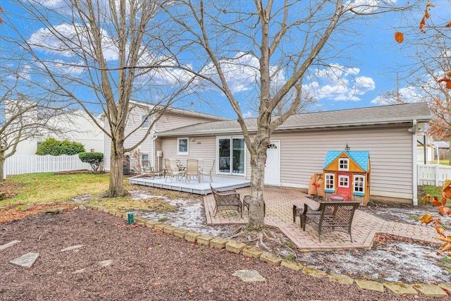 back of property with a patio