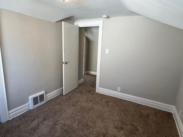 bonus room featuring carpet and lofted ceiling