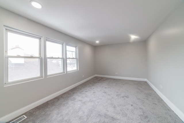 unfurnished room with carpet floors