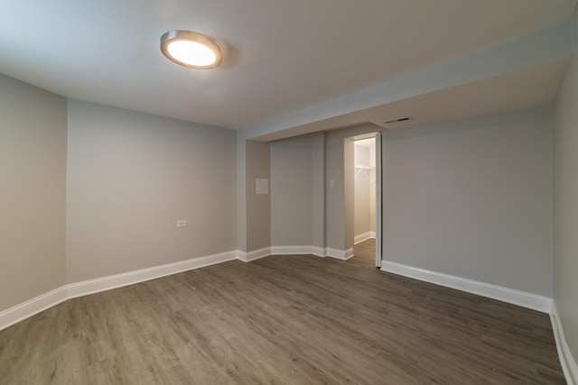 basement featuring dark wood-type flooring