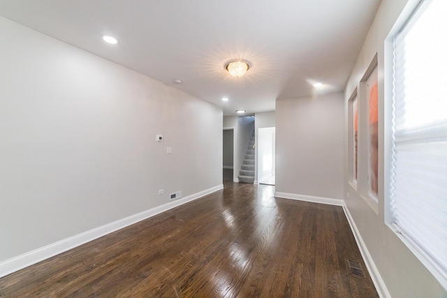 empty room with dark hardwood / wood-style floors