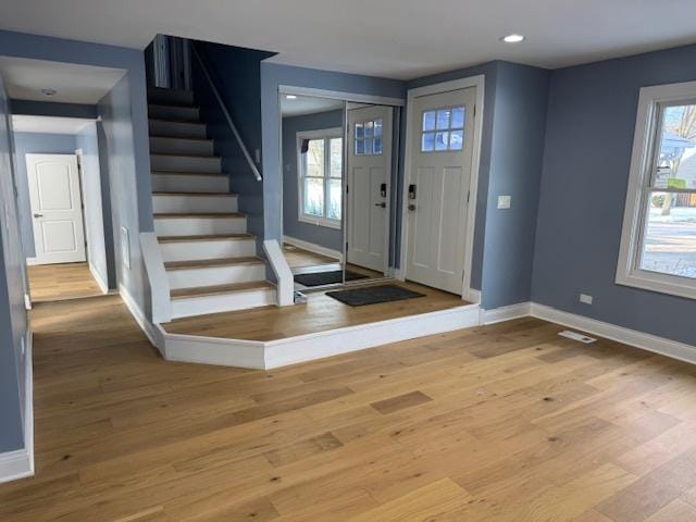 entryway featuring hardwood / wood-style floors and a healthy amount of sunlight