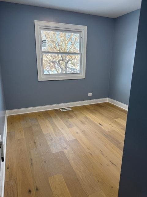 unfurnished room featuring light wood-type flooring