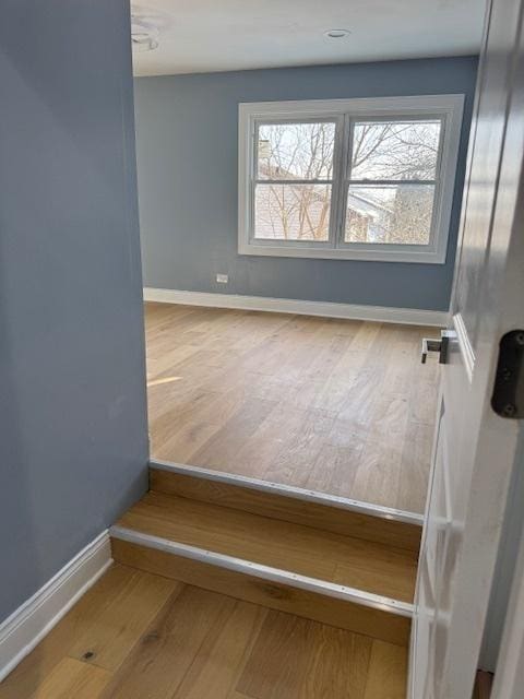 empty room featuring hardwood / wood-style flooring