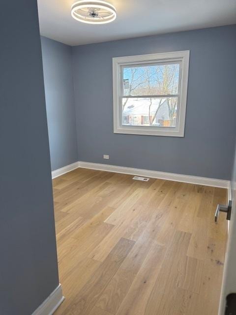 empty room featuring light hardwood / wood-style floors