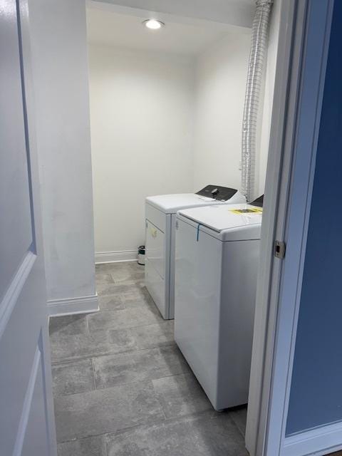 laundry room featuring separate washer and dryer