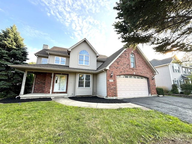 view of front property featuring a front lawn, a porch, and a garage