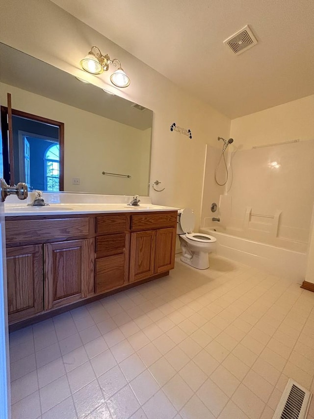 full bathroom with tile patterned floors, vanity, shower / bathtub combination, and toilet