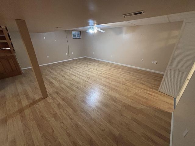 basement with hardwood / wood-style floors