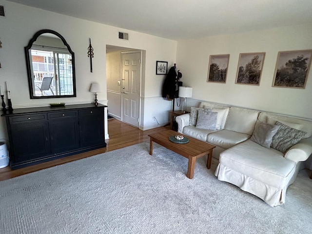 living room featuring dark wood-type flooring