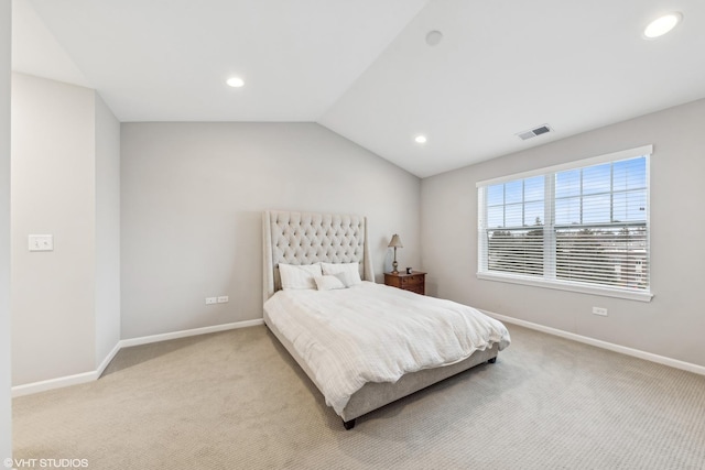 carpeted bedroom featuring lofted ceiling