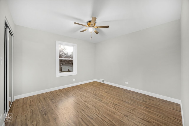 unfurnished bedroom with hardwood / wood-style floors and ceiling fan