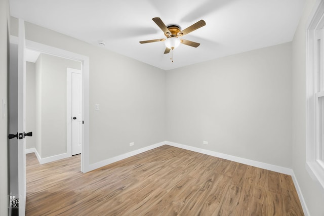 spare room featuring light hardwood / wood-style floors and ceiling fan