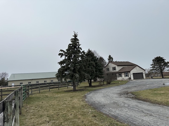 view of front facade featuring a garage and a front lawn