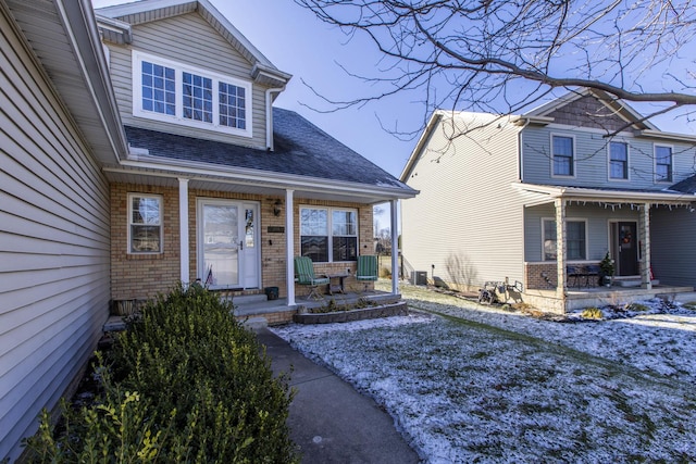 entrance to property featuring covered porch