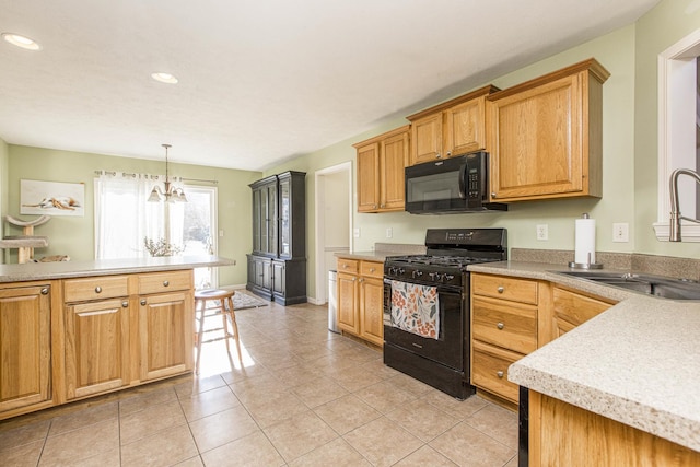 kitchen featuring sink, black appliances, light tile patterned floors, decorative light fixtures, and an inviting chandelier